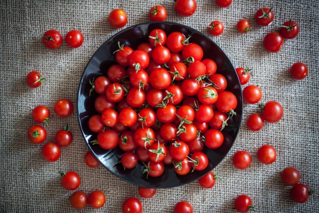 vintage cherry tomatoes on black plate