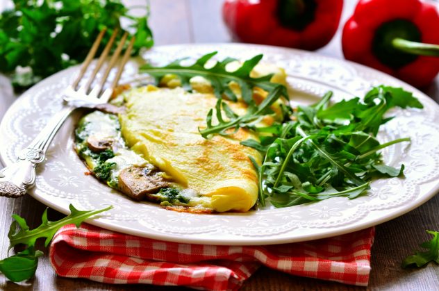 Omelet stuffed with spinach and mushrooms.